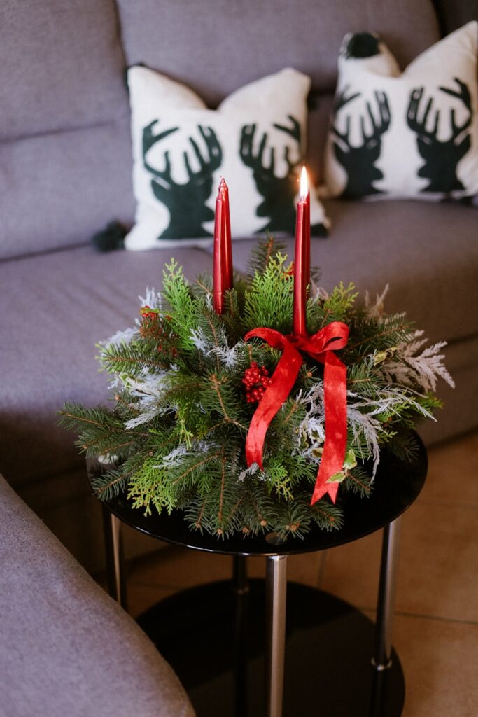 Christmas advent wreath with two lit red candles.